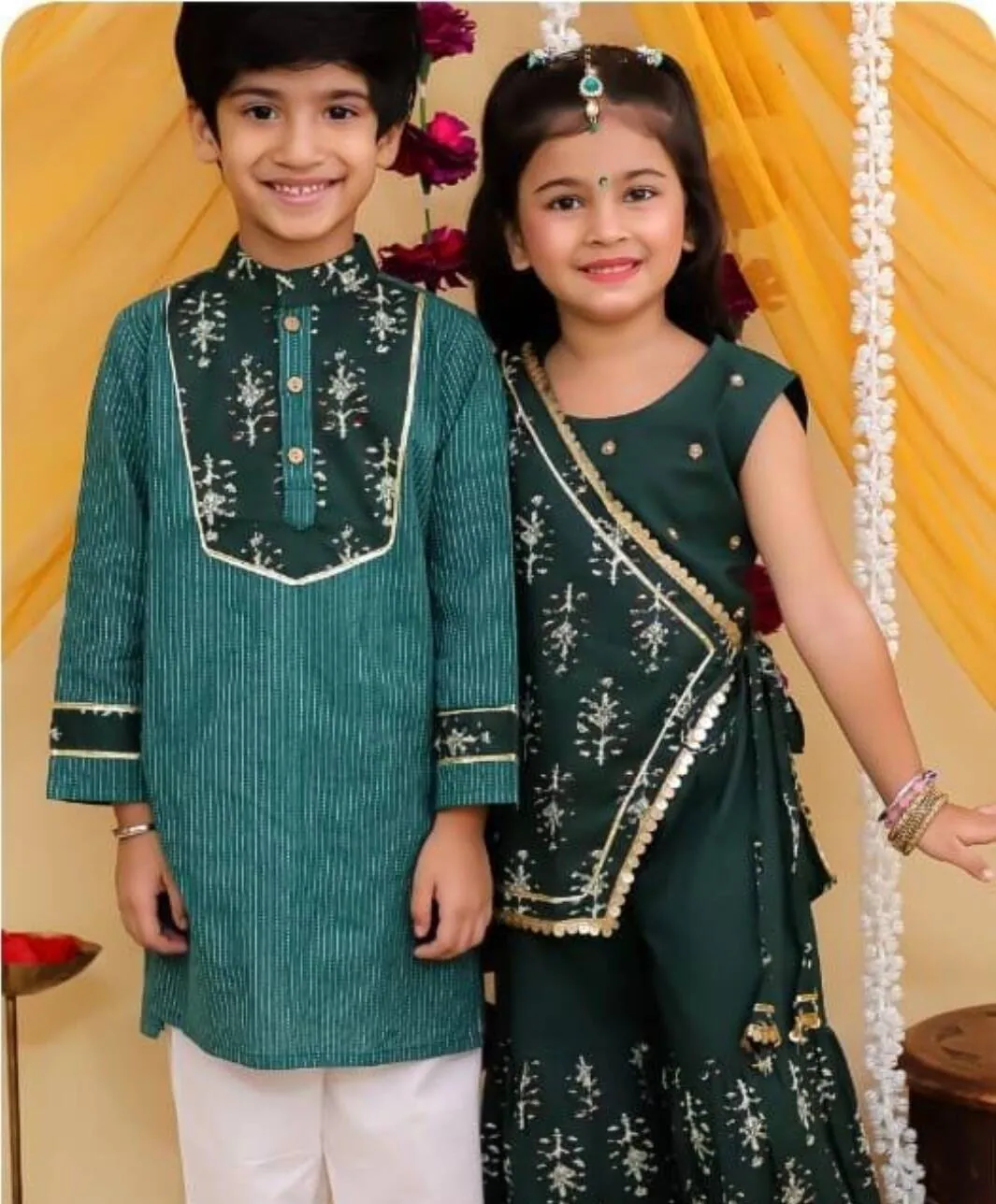 Brother and sister in emerald green kurta and sharara